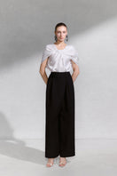 Arti Apparel VERIS TOP, stylish casual top with a relaxed fit and soft fabric, shown in a close-up view.