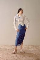 Shiny lumin blue draped midi skirt by Lecia, featuring a sleek, flowing design with a metallic finish and elegant draping.