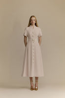 White Plan Rosalie Midi Dress featuring a flowy fabric, sleeveless design, and elegant silhouette perfect for summer wear.