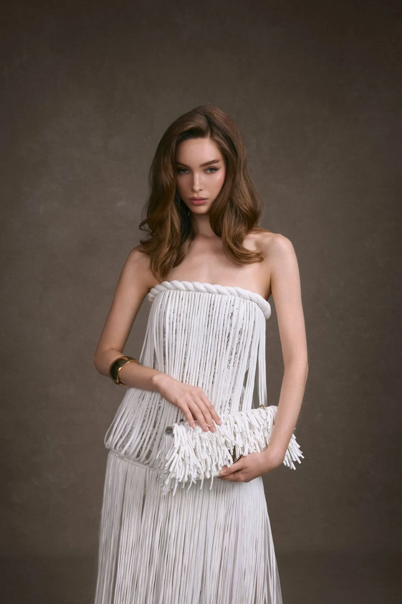 Keira Tong fringe lace maxi dress featuring a fitted corset top and flowing skirt with intricate lace details.