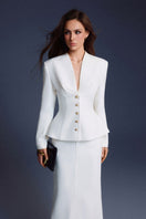 White folded buttons top by Keira Tong, featuring a stylish design with folded button details, shown laid flat.
