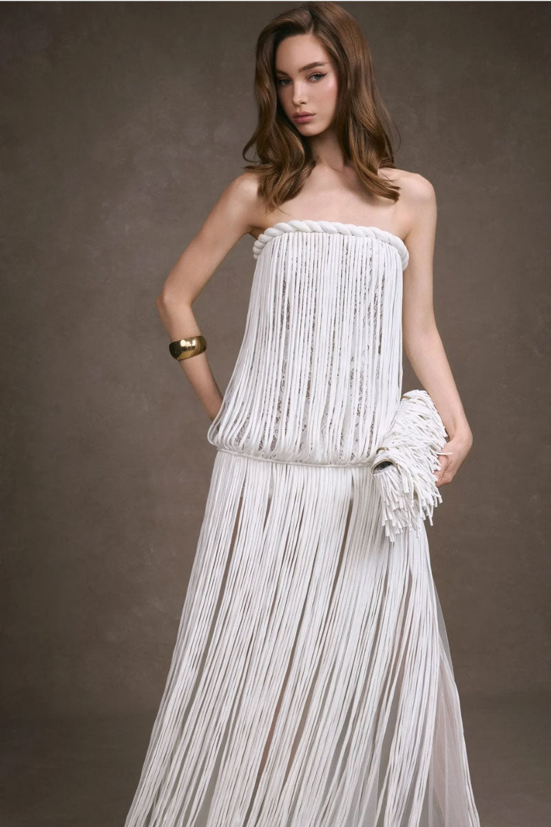 Keira Tong fringe lace maxi dress with a fitted corset bodice and flowing skirt, featuring intricate lace and fringe details.