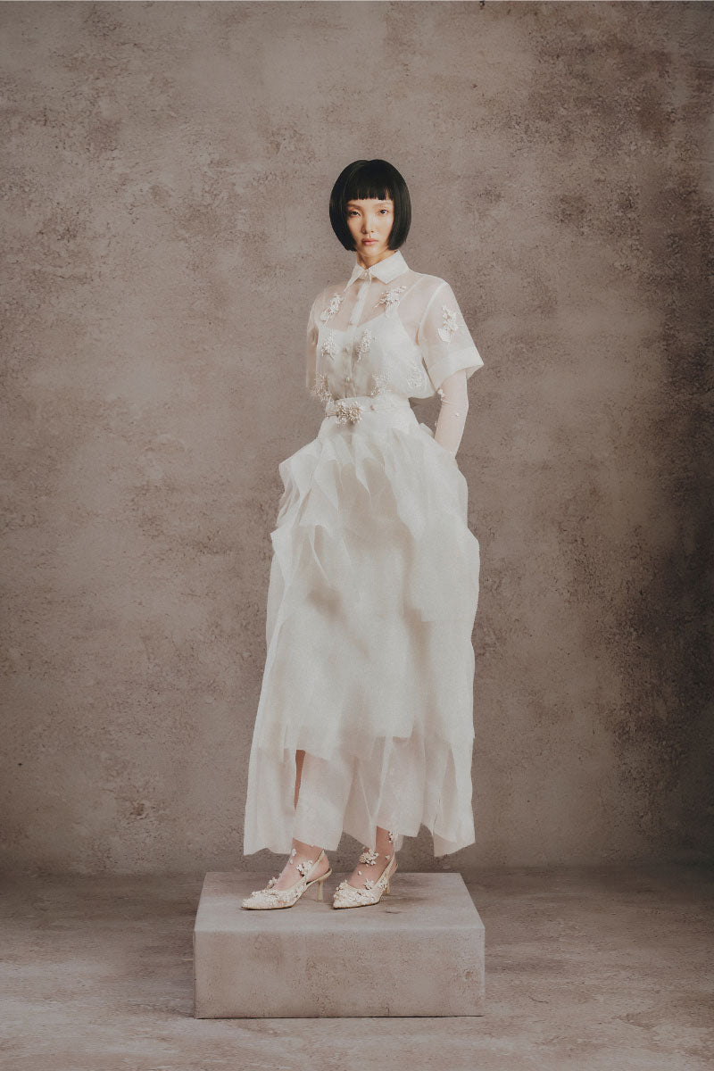 Elegant ivory Whisper Layer gown by White Plan, featuring flowing fabric and layered design, perfect for formal occasions.
