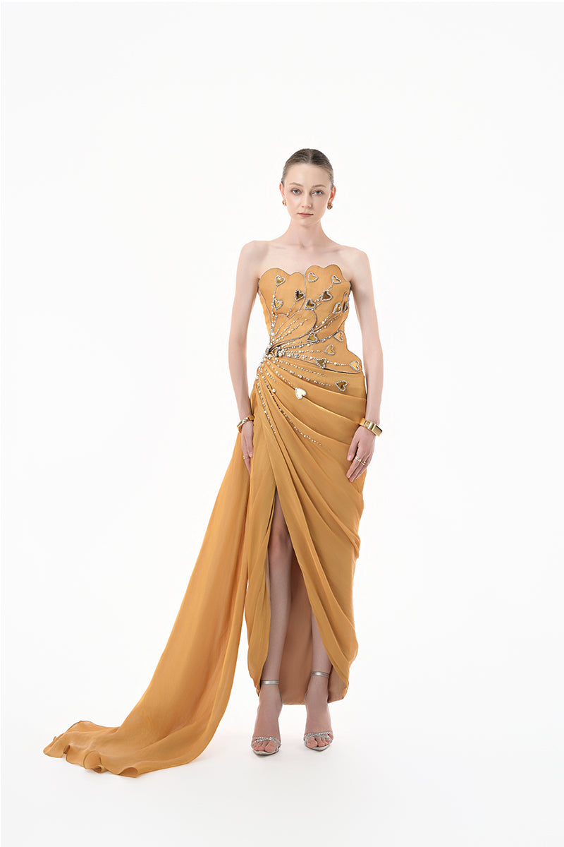 Elegant chartreuse gold heart-embellished draped gown by Happy Clothing, featuring flowing fabric and intricate design details.