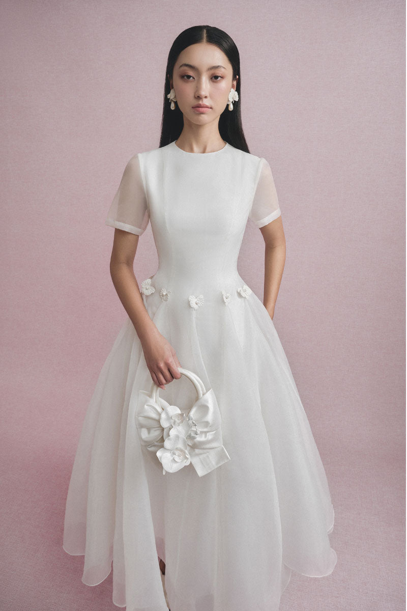 White Plan Elina Tulle Midi Dress displayed on a hanger with soft tulle fabric and a flowing silhouette.