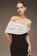 Serene off-shoulder gown by Margée Atelier featuring flowing fabric and elegant design perfect for formal occasions.