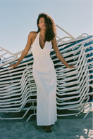 Off-white Turin maxi dress by Summer Away, flowing fabric and elegant design featured in this image.