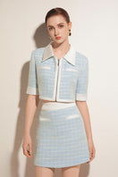 Valenciani mint tweed mini skirt with a fitted waist and stylish hem, perfect for a chic and trendy look.