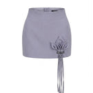 Keira Tong grey Lily mini skirt with fitted waist and short hem, styled on a model for a casual fashion look.