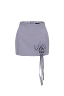 Keira Tong grey Lily mini skirt with fitted waist and short hem, styled on a model for a casual fashion look.