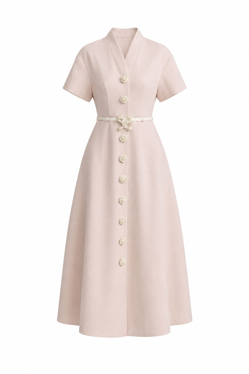 White Plan Rosalie Dress, a stylish midi dress with floral pattern, shown on a model in a bright, airy setting.