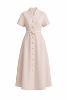 White Plan Rosalie Dress, a stylish midi dress with floral pattern, shown on a model in a bright, airy setting.