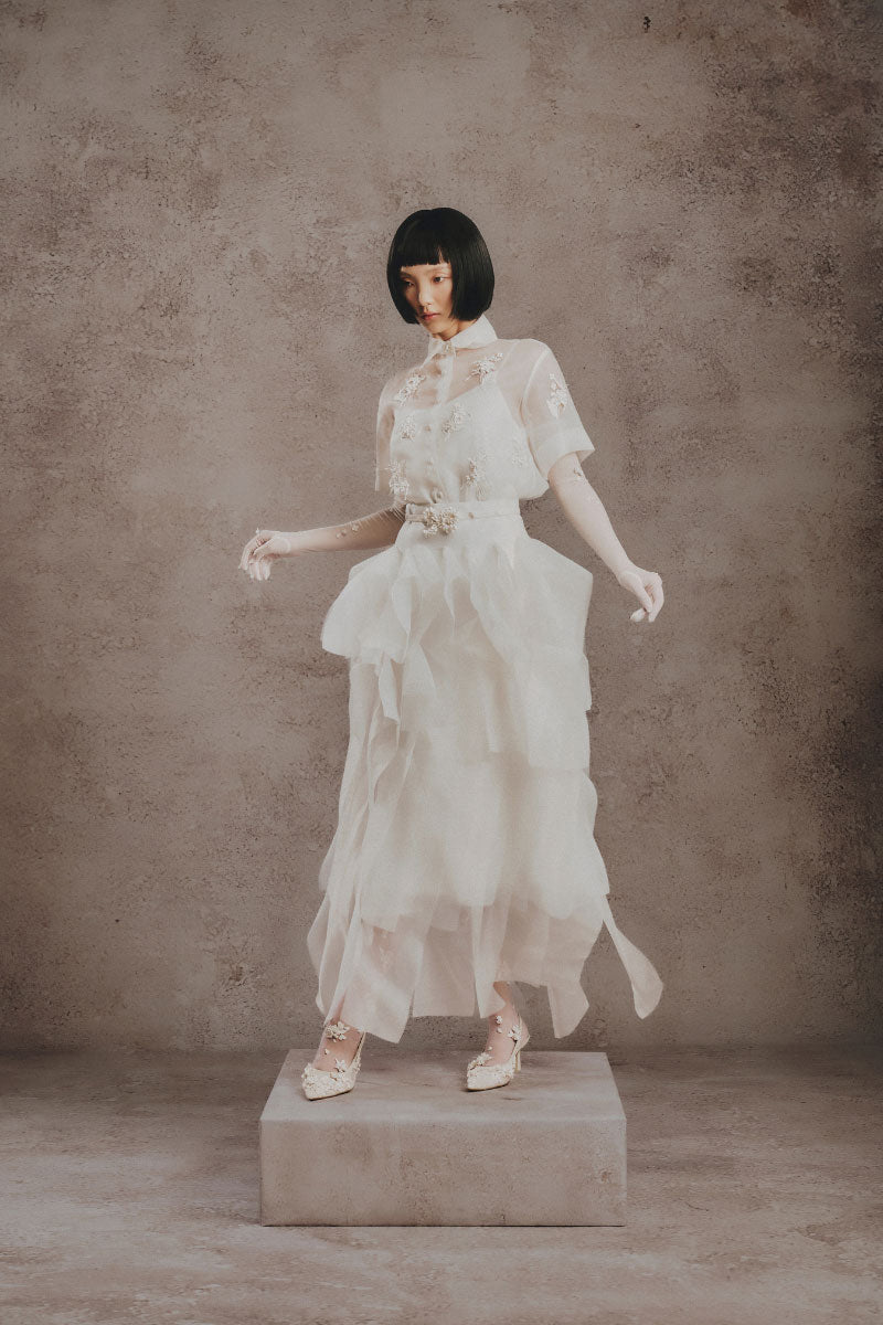 White Plan Ivory Whisper Layer Midi Dress displayed on a model, featuring layered fabric and elegant midi length.
