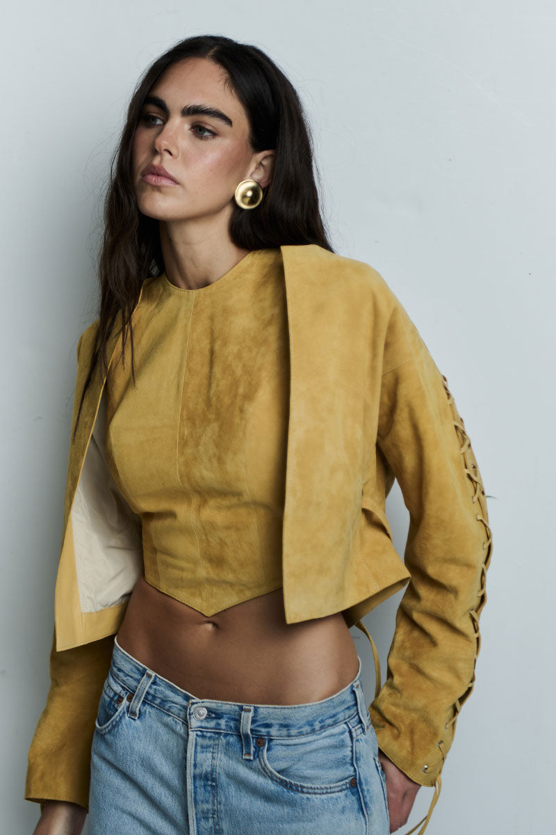 ZUT SAM Mango top, stylish sleeveless blouse in vibrant mango color, front view with round neckline and relaxed fit.