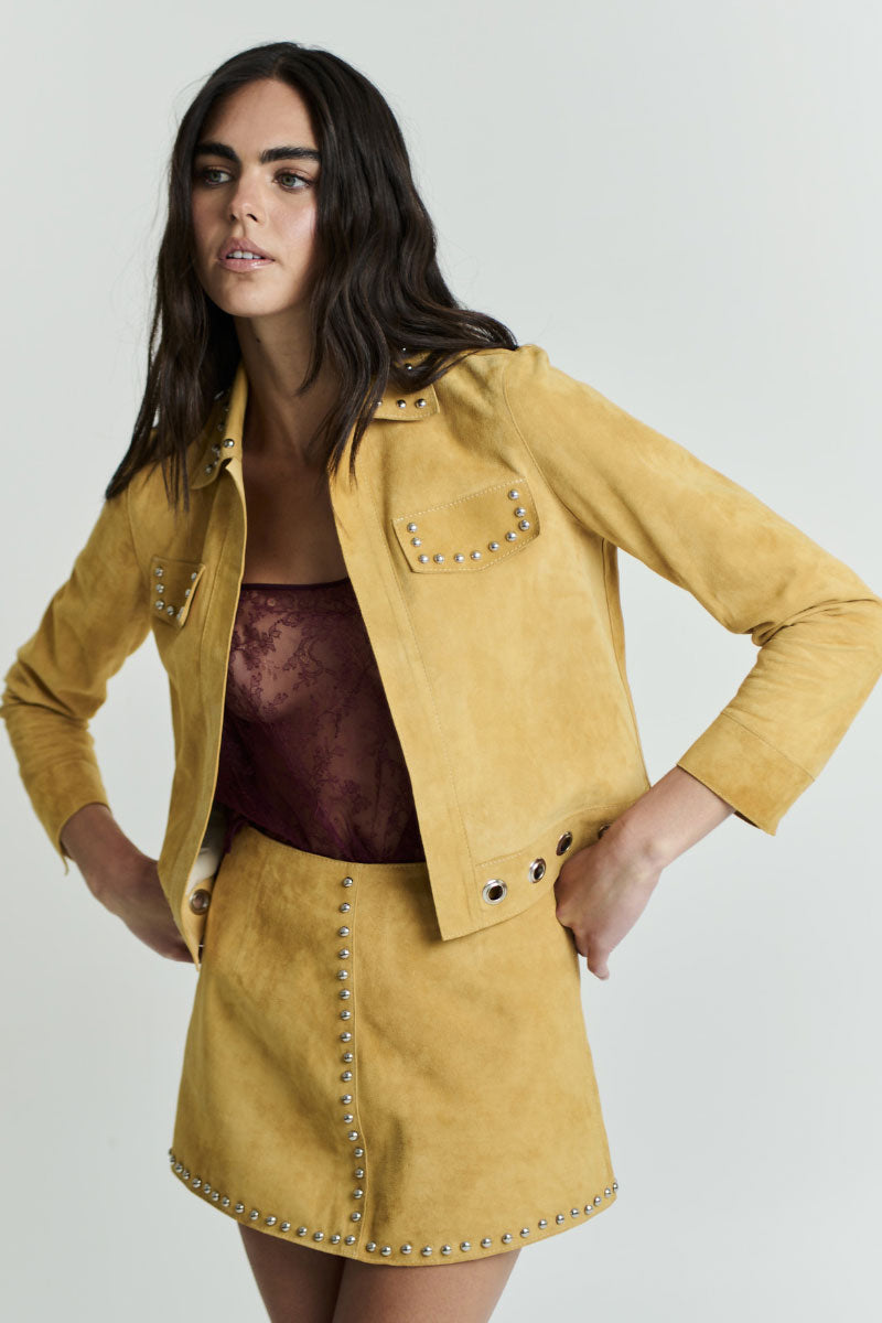 ZUT Tellier mini skirt in vibrant mango color, featuring a stylish fitted design perfect for casual or dressy outfits.