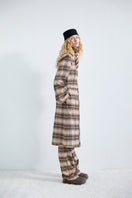 Brown checked flared pants by ColoReve featuring a flat, wide-leg design and stylish pattern.