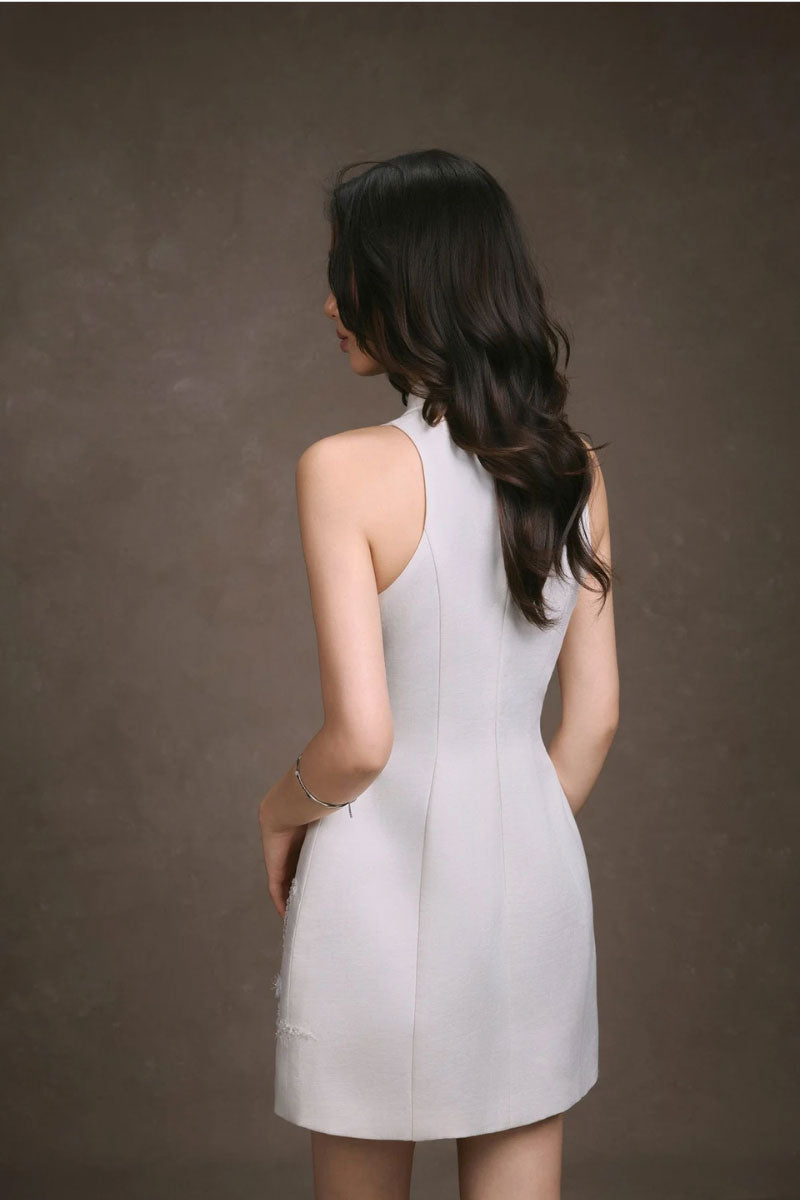 Flora embroidered mini dress by KEIRA TONG featuring colorful floral embroidery and a feminine silhouette.