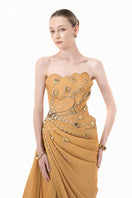 Elegant chartreuse gold gown with heart embellishments and draped design by Happy Clothing, featuring flowing fabric and intricate detailing.