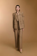 Arti Apparel CECI blazer, stylish tailored blazer with a fitted design, shown on a hanger in a neutral color.