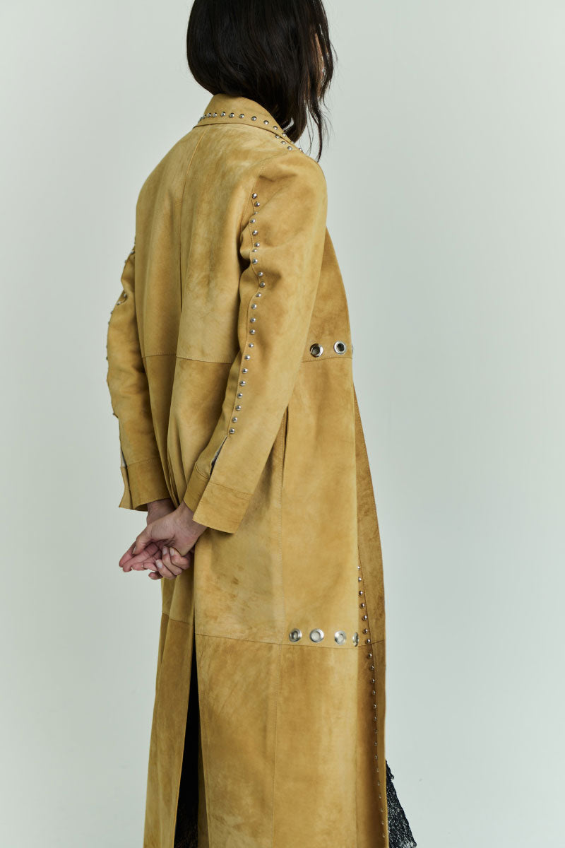 ZUT ANTAR coat in vibrant mango color, stylish outerwear with a tailored fit, displayed on a hanger against a neutral background.