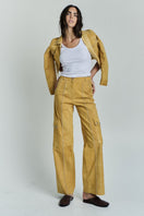 ZUT studded Sam pants in Mango color, stylish pants with metal stud accents, shown on a model.