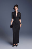 Keira Tong zipper peplum maxi dress featuring a fitted bodice, peplum detail, and flowing skirt in elegant fabric.