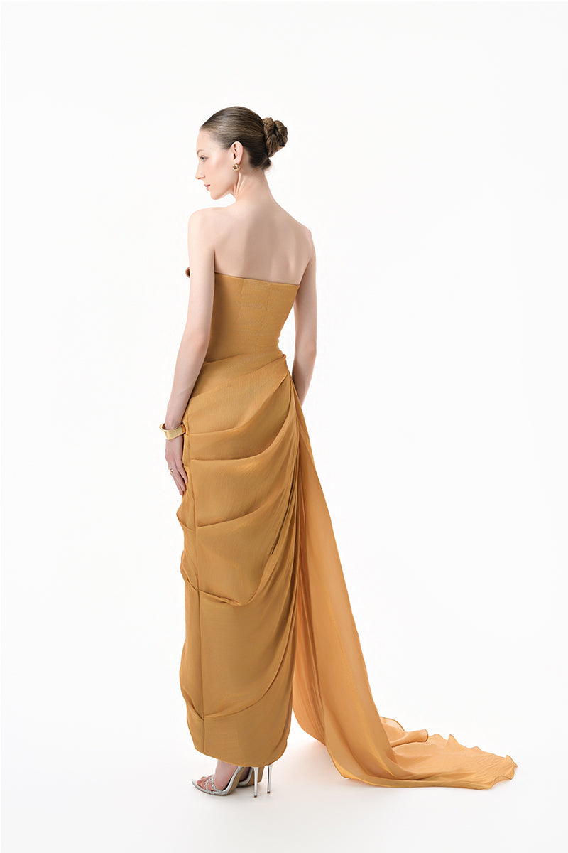 Elegant chartreuse gold heart-embellished draped gown by Happy Clothing, featuring a flowing silhouette and intricate detailing.