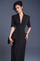 Keira Tong zipper peplum maxi dress featuring a fitted bodice, peplum detail, and flowing skirt in elegant fabric.