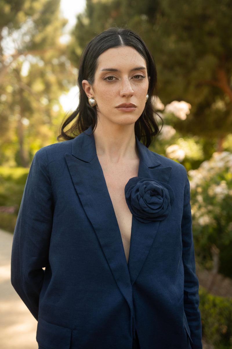 Navy LOVE blazer by Estefania, tailored blazer with lapels and structured fit, displayed on a hanger.