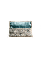 White gold pineapple clutch by VERDI with turquoise accents, featuring a stylish and compact design for elegant evening wear.