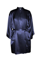 NK IMODE zero waste robe made from eco-friendly fabric, shown in a relaxed fit with a belt and long sleeves.