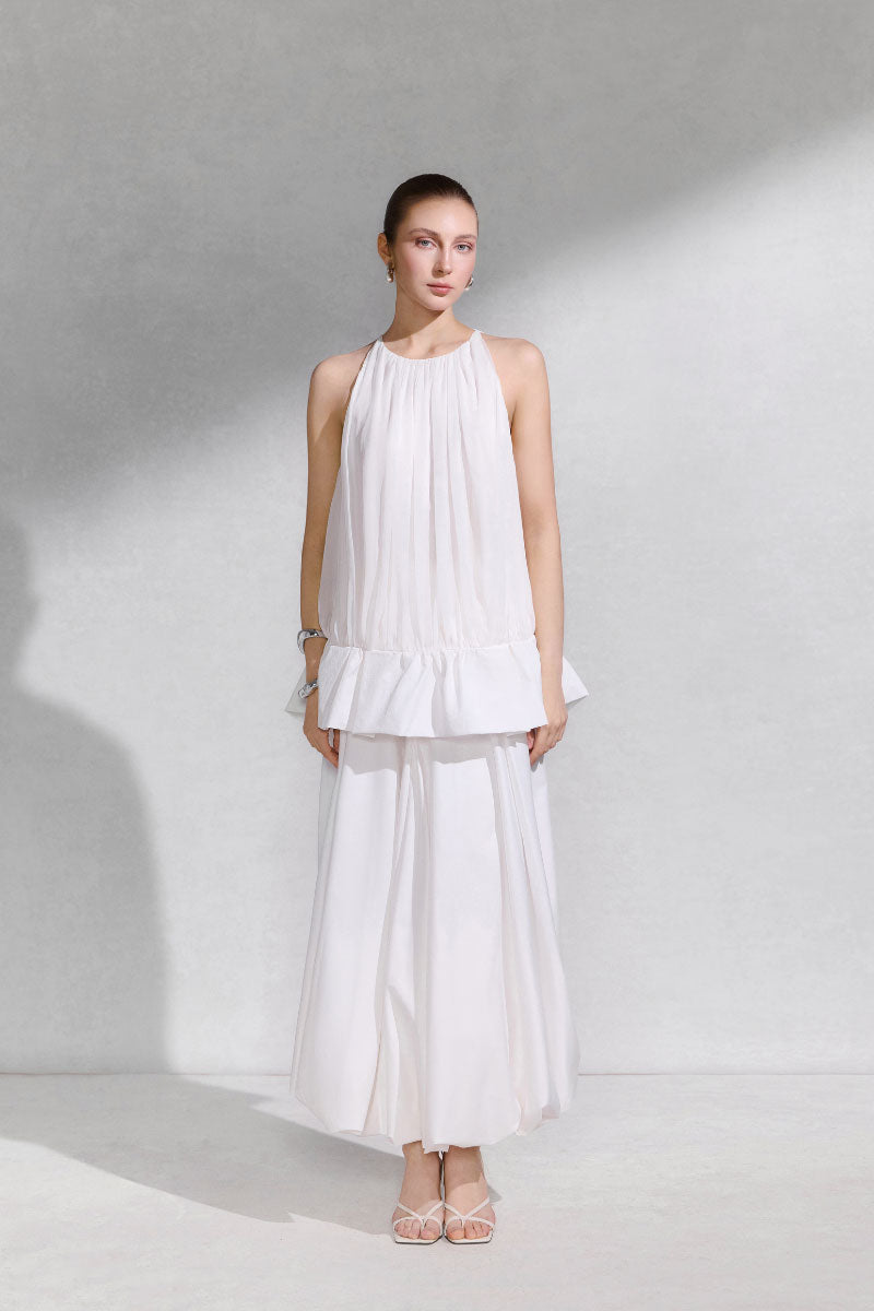 Arti Apparel Moneta Midi Skirt in a stylish midi length with a flowy silhouette and versatile design.