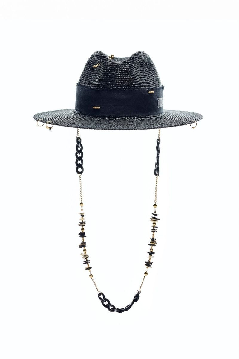 Black fedora hat by LE SH KA featuring shells and 24k gold-plated accessories, stylish headwear with decorative embellishments.