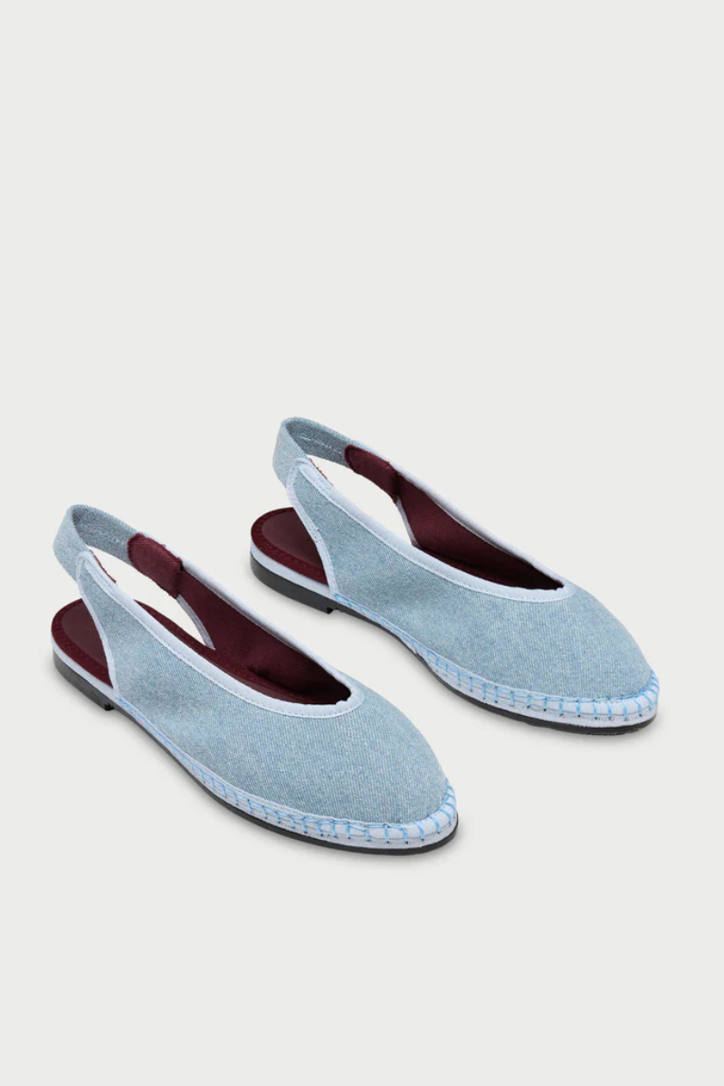 Flabelus Narnia light denim flats with light blue piping, featuring a stylish casual design and comfortable flat sole.
