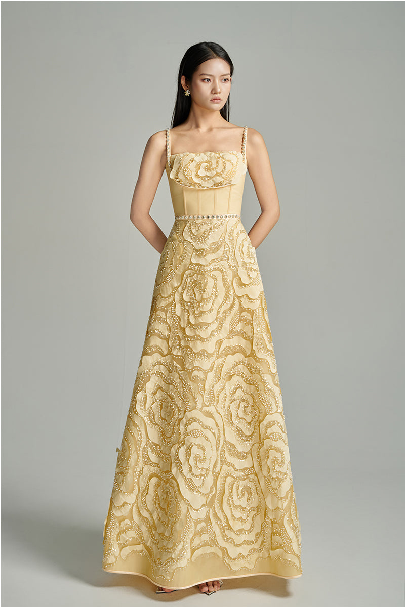 Beige CULT MIA X HAPPY CLOTHING floral wave A-line gown with elegant flowy fabric and floral design, perfect for formal occasions.
