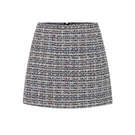 Valenciani multicolor tweed mini skirt with a fitted waistband and classic mini length, showcasing vibrant, textured fabric.
