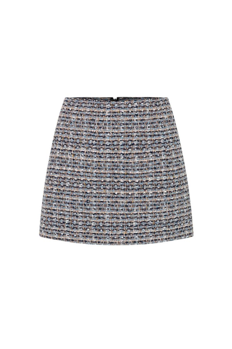 Valenciani multicolor tweed mini skirt with a fitted waistband and classic mini length, showcasing vibrant, textured fabric.