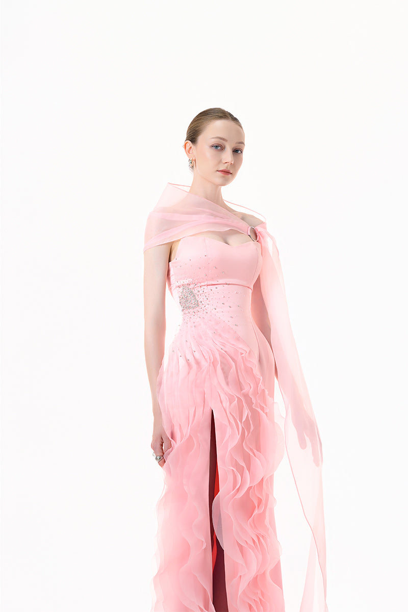 Blush pink draped ruffle gown by Happy Clothing, featuring elegant flowing fabric and ruffle details for formal occasions.