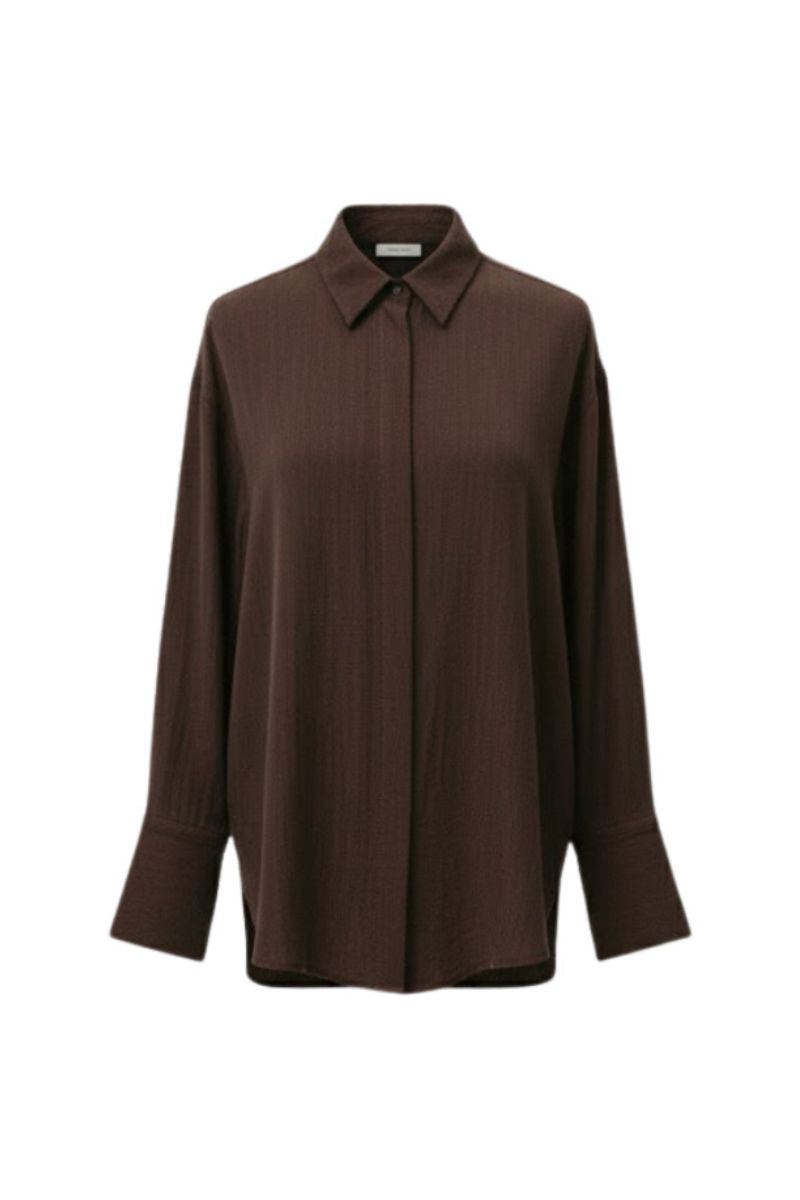 Oversized double-layer cuff shirt by Lecia, featuring long sleeves with layered cuff design and relaxed fit in soft fabric.