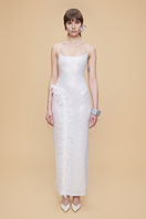 White fully rhinestone-embellished maxi dress with lace ruffle detail by Sudi Etuz, showcasing elegant design and intricate embellishments.