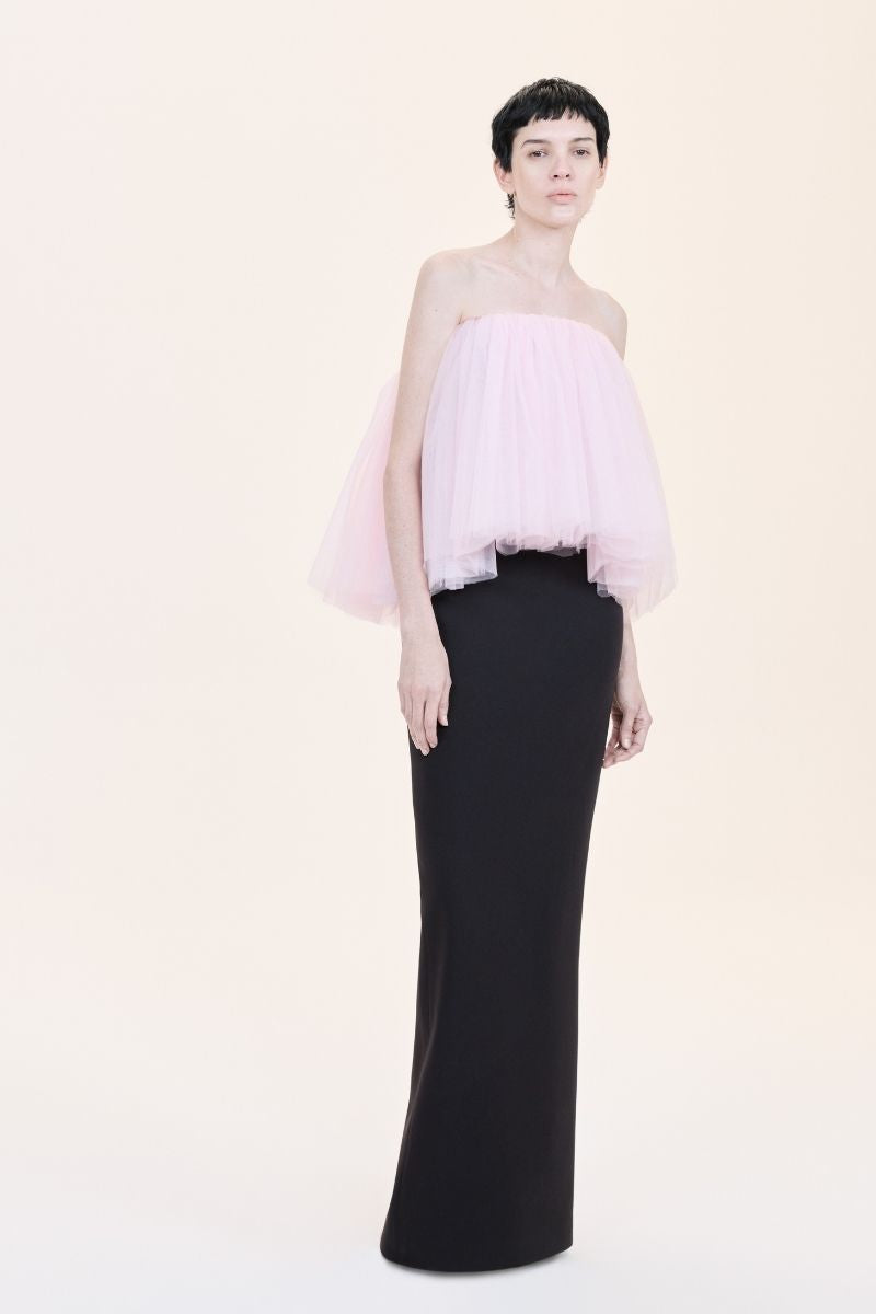 Nihan Peker LA BOMBA gown in vibrant red fabric with elegant draping and floral accents, perfect for formal occasions.