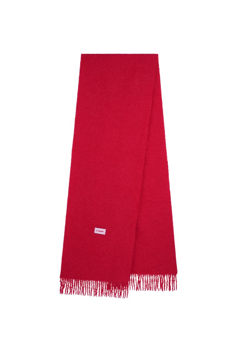 Red oversized scarf from La Granni featuring soft, flowing fabric and stylish wrap-around design.