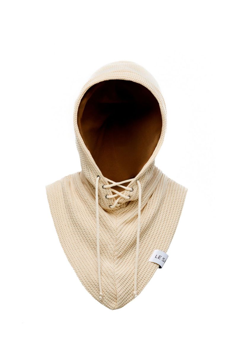Beige balaclava hat by LE SH KA, close-up of the soft, snug fabric covering the head and neck for warmth and protection.