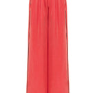 niLuu AQUAFLORA lounge pants in coral, lightweight and comfortable pants with a relaxed fit, shown on a model.