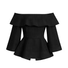 Black Ana + Maria Marena blouse, stylish women's tops, featuring a relaxed fit and elegant design, shown on a hanger.