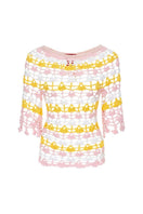 Handmade pink and yellow crochet top featuring a bird of paradise design by Andreeva, perfect for stylish summer wear.