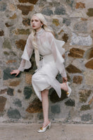 Lindsay co-ord set from White Plan featuring a stylish shirt and bone-colored skirt, shown in a coordinated outfit.