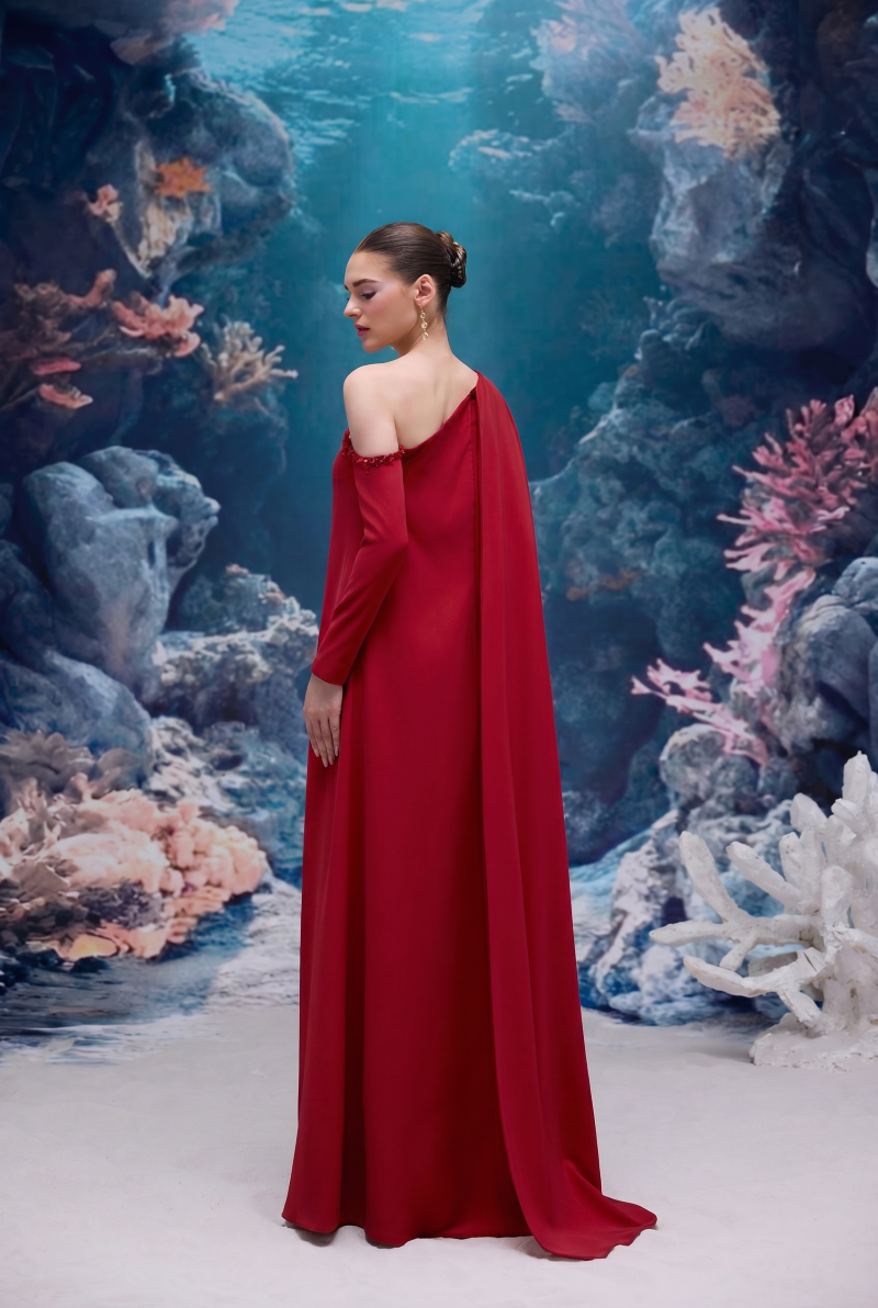 Red LINNEA crepe gown by 21Six featuring a flowing silhouette and elegant design, perfect for formal occasions.