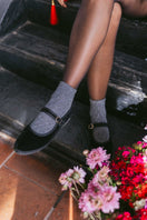 Black Flabelus Antonia flats showing sleek slip-on design with rounded toe and smooth leather finish.