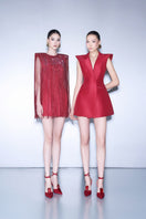 CEM red V-neck mini dress displayed on a hanger, showcasing its sleek design and vibrant color suitable for casual or semi-formal wear.